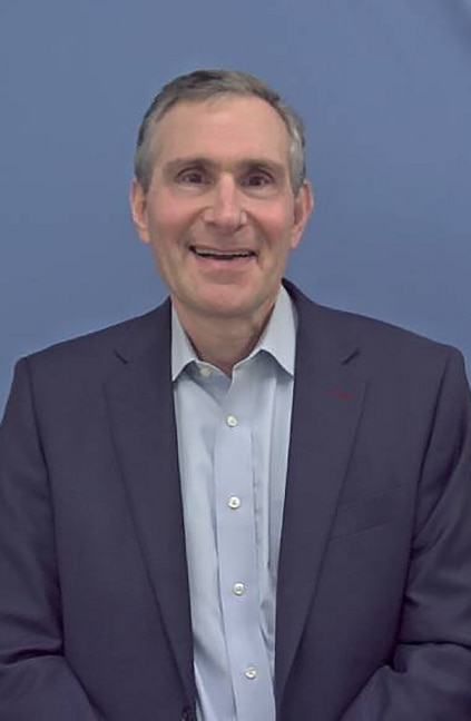 A professional headshot of Cliff Schlesinger