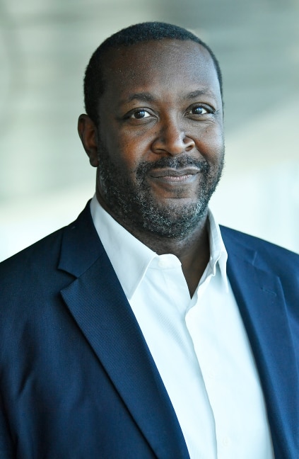 A professional headshot of Darren Allaway