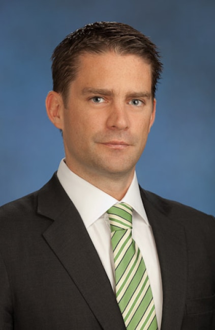 A professional headshot of Jean-Paul Churchouse