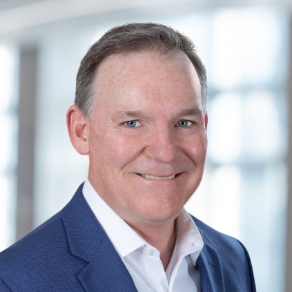 A professional headshot of John Burpee