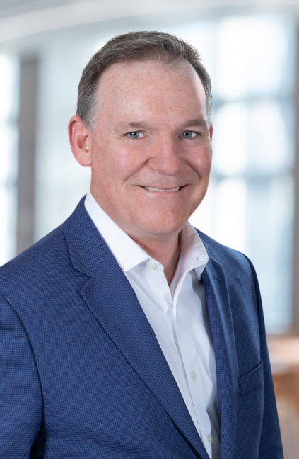 A professional headshot of John Burpee