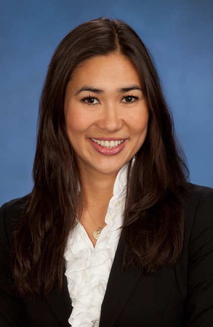 A professional headshot of Kristin Olson