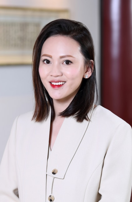 A professional headshot of Ling Pong