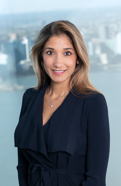 A professional headshot of Meena Flynn