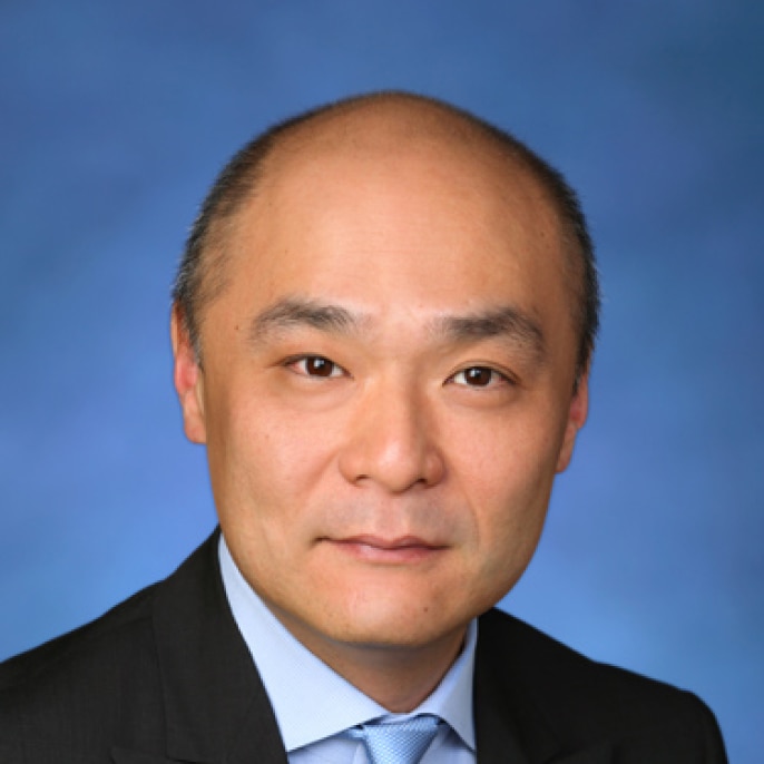 A professional headshot of Nick Yim