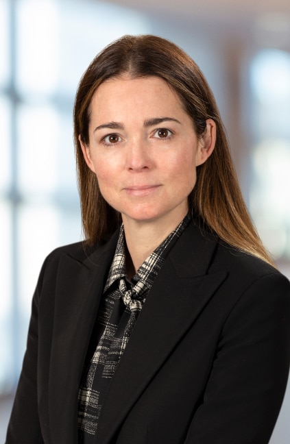 A professional headshot of Sarah McNally