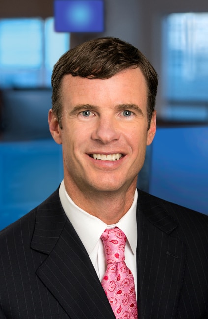 A professional headshot of Scott Mueller