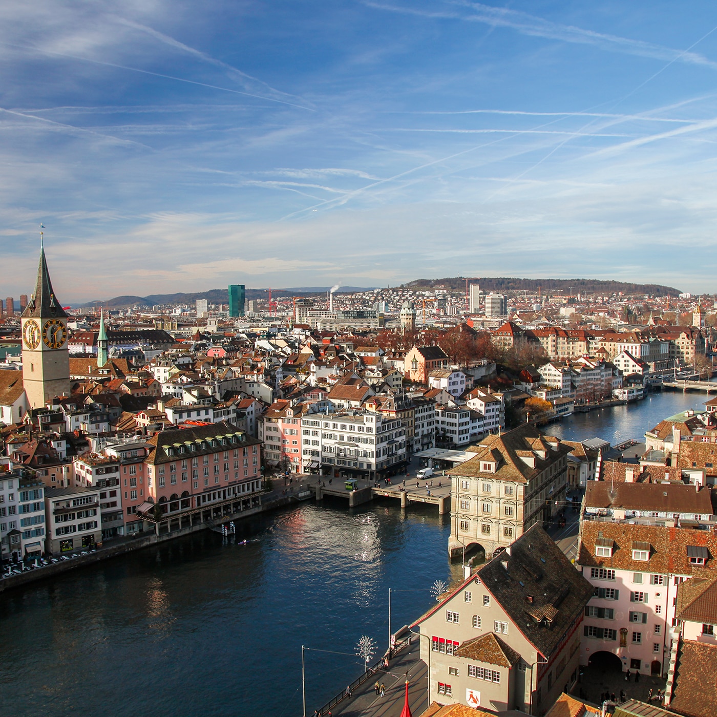 Aerial view of Zurich’s old town with the Limmat River and the St. Peter church clock tower.