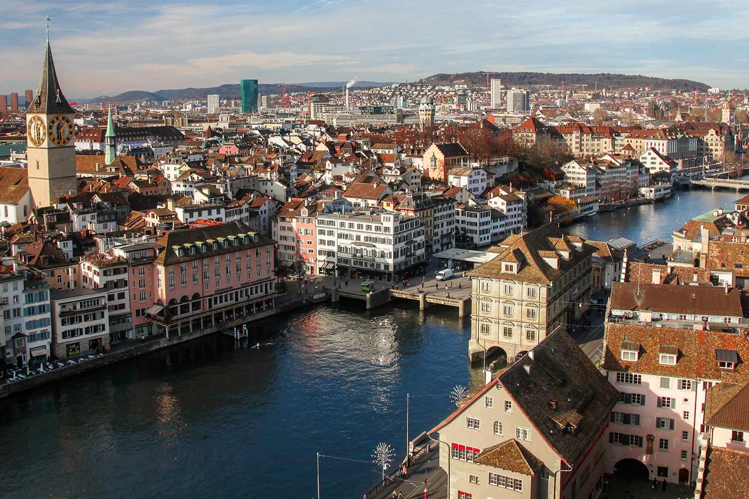 Aerial view of Zurich’s old town with the Limmat River and the St. Peter church clock tower.