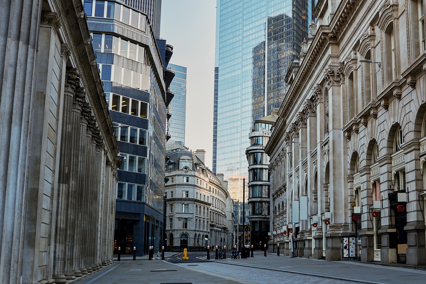 Classical architecture meets modern skyscrapers in London’s financial district.