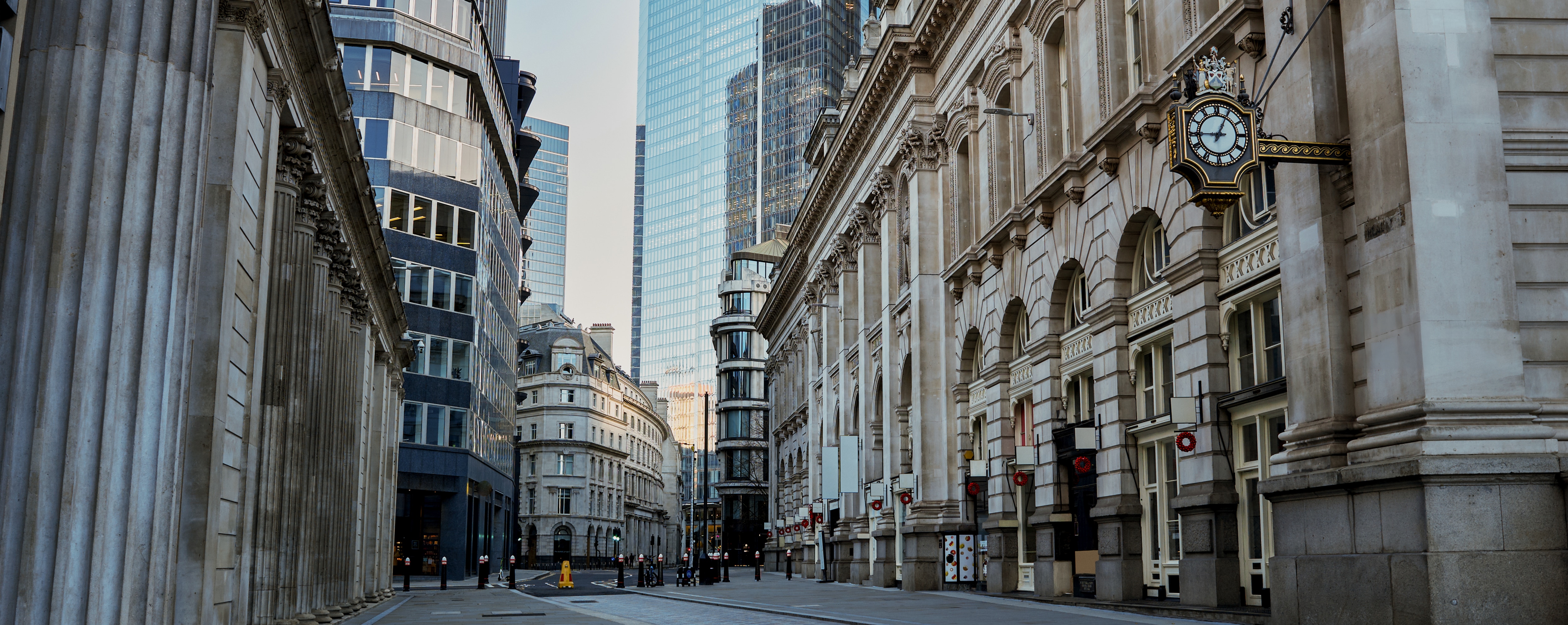 Classical architecture meets modern skyscrapers in London’s financial district.