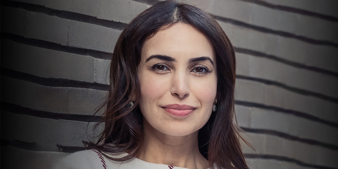 A professional headshot of May Habib.