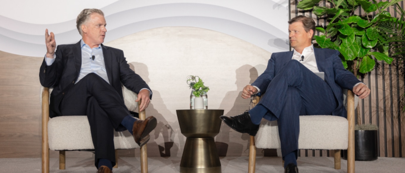 Keating Crown and John Mallory seated on stage at the Family Founders Forum, engaged in a discussion about multi-generational family office strategies.