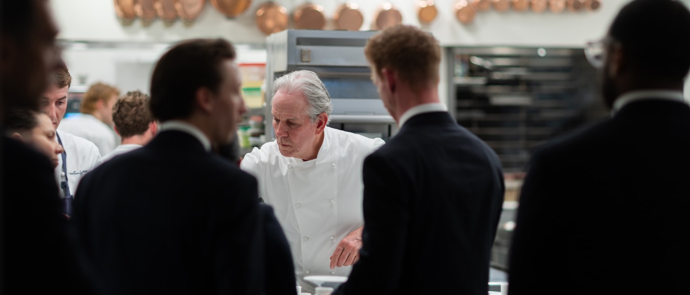 Chef Thomas Keller preparing an exclusive 10-course meal for founders and entrepreneurs at The French Laundry. 