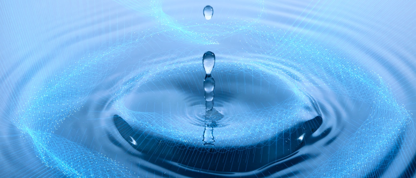 Drips creating ripples in a water surface