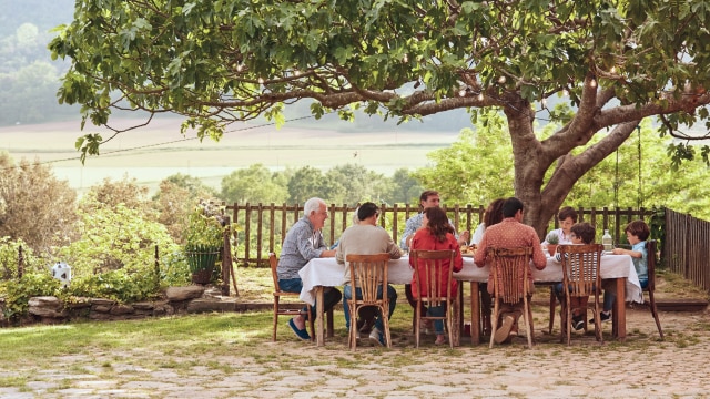 Family members in conversation about shared goals and legacy planning.