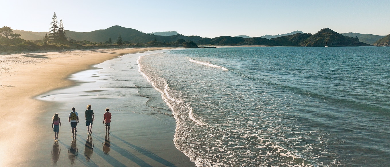 Family walking on beach