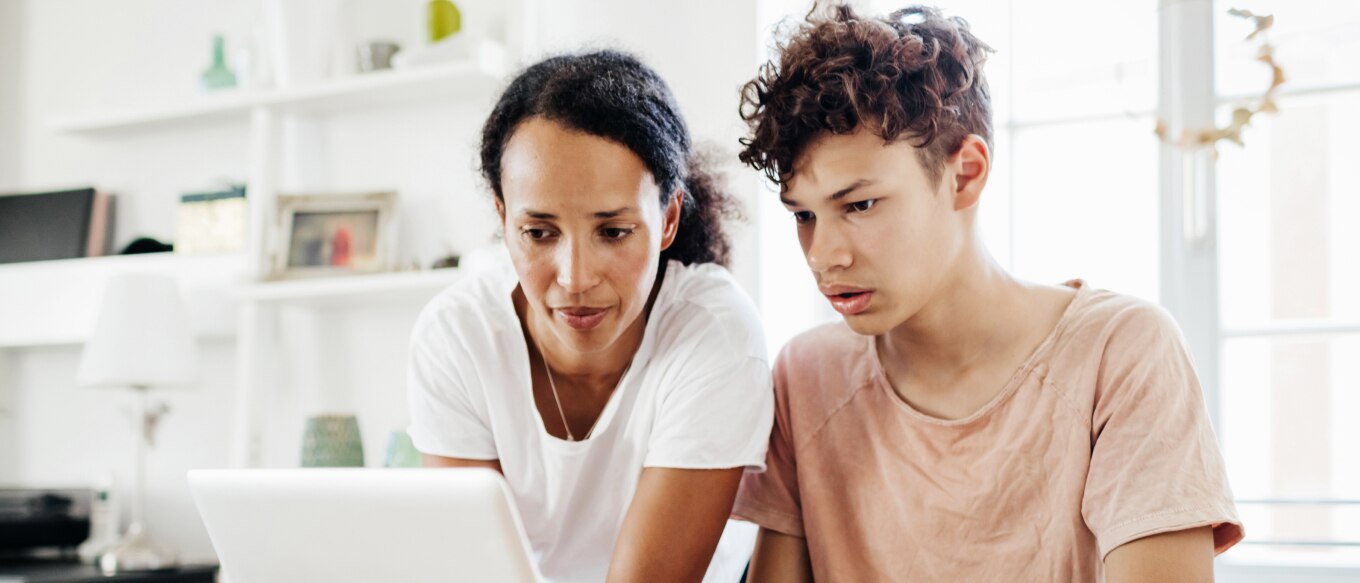 Woman and child looking at laptop.
