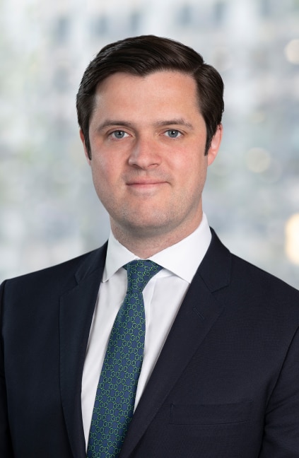 A professional headshot of Sean Murphy