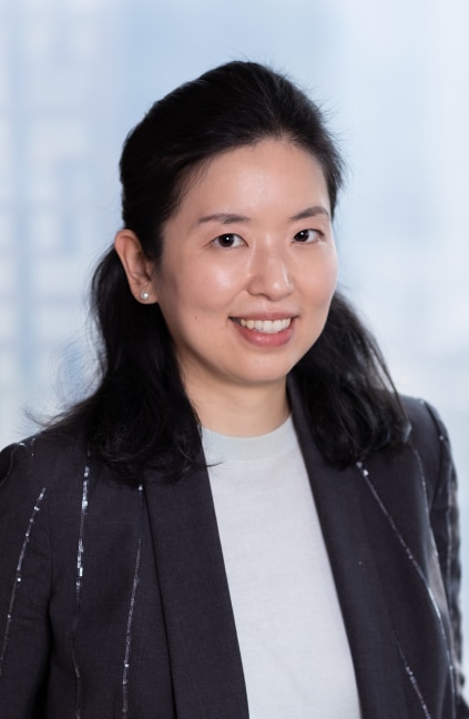 A professional headshot of Yan Liu