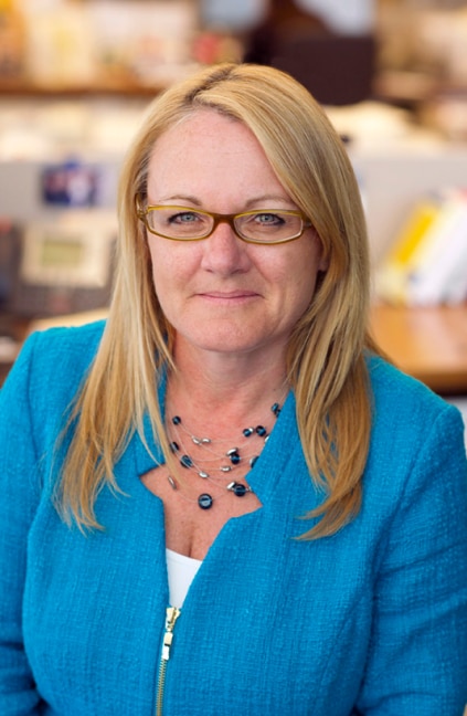 A professional headshot of Darleendede Agar